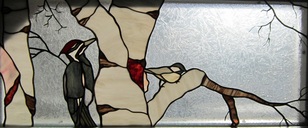 stained glass birds pileated woodpecker and chickadee
