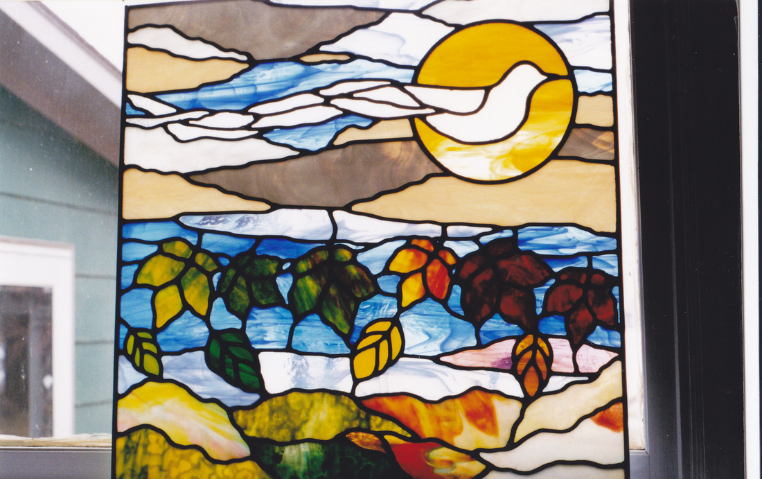 foiur seasons dove window in stained glass